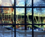 parking-garage-and-Basilica-reflected-in-courthouse-windows-Lewiston_DSC03317