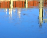 parking-garage-and-Basilica-reflected-in-puddle-Lewiston_DSC03299