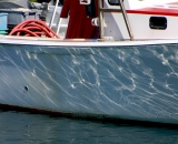 water-reflections-on-side-of-fishing-boat_DSC03771
