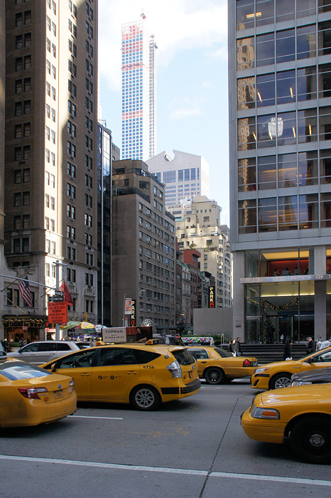 Street scene with yellow cabs